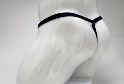 Black thong displayed on white mannequin featuring wildmant modal micro thong big boy pouch in pink material