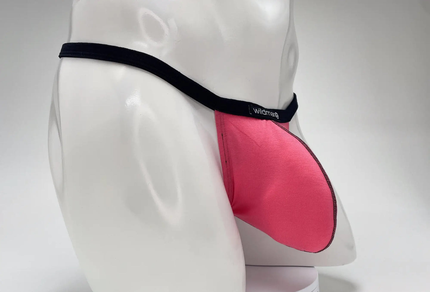 Pink wildman modal micro thong briefs with black elastic waistband and big boy pouch design