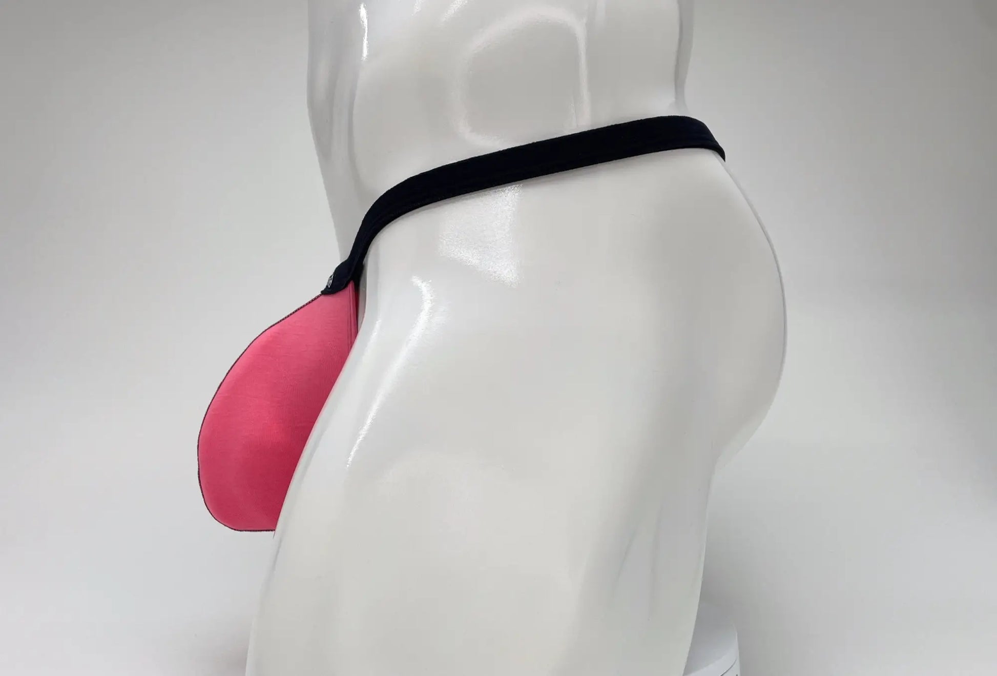 Wildmant modal micro thong big boy pouch in pink silicone with black elastic band for comfortable support
