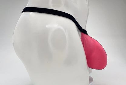 WildmanT modal micro thong with a prominent pink big boy pouch and black waistband on a white mannequin.