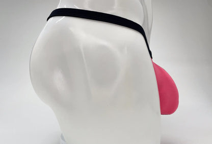 Pink WildmanT Modal micro thong with a prominent pouch, worn on a white mannequin against a white background.