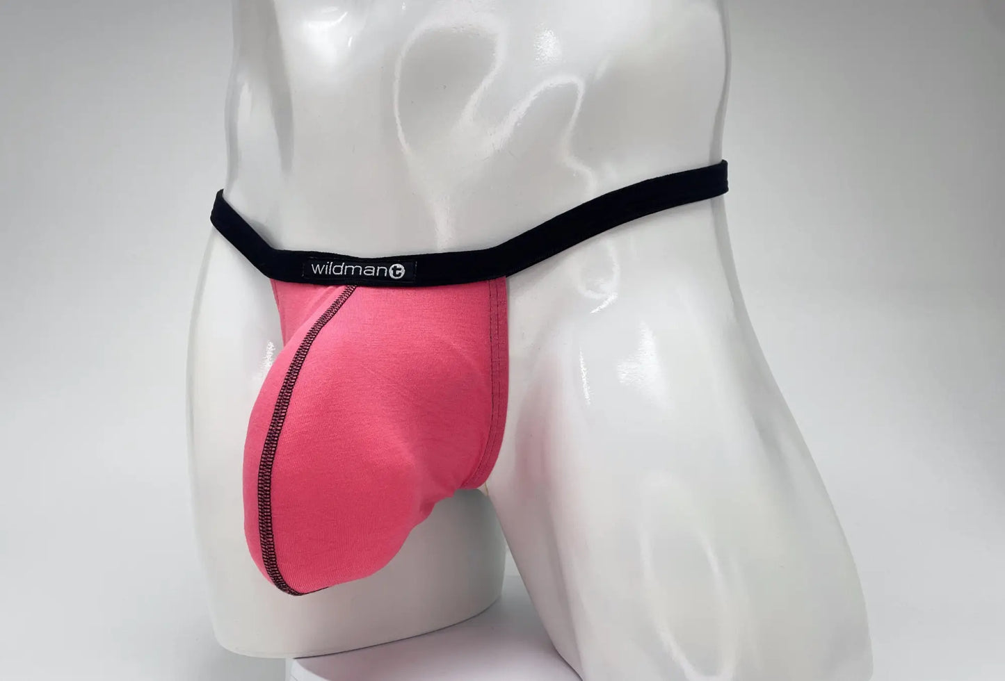 Pink wildman mens modal micro thong briefs with black waistband and side zipper detail big boy pouch design