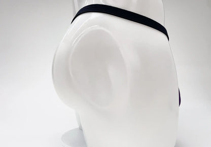 Black elastic waistband of wildmant modal micro thong big boy pouch purple men’s underwear on mannequin front view