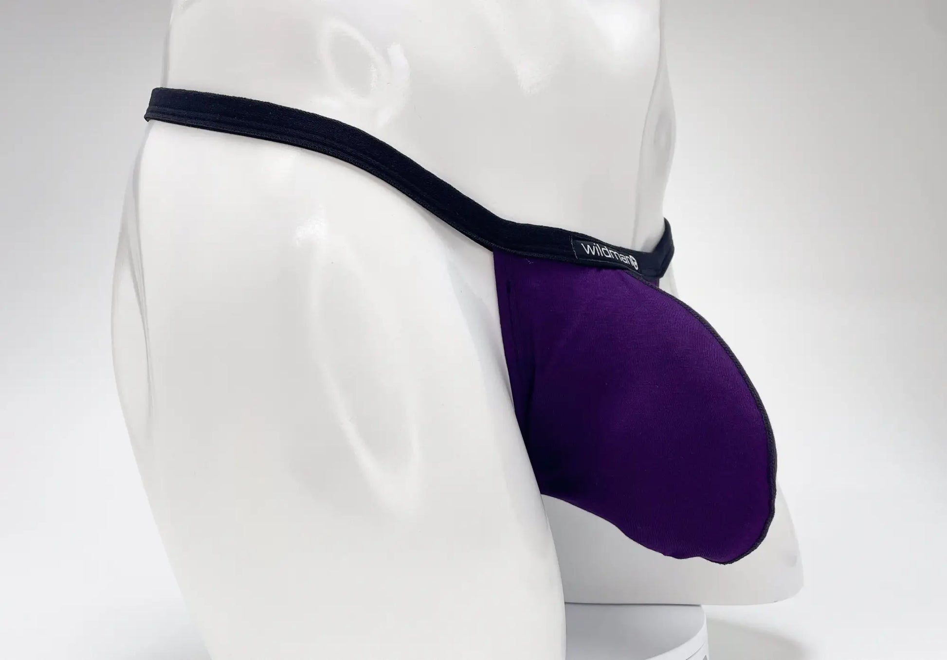 Purple modal fabric jockstrap with black wildtang elastic waistband featured in the wildmant modal micro thong big boy pouch purple