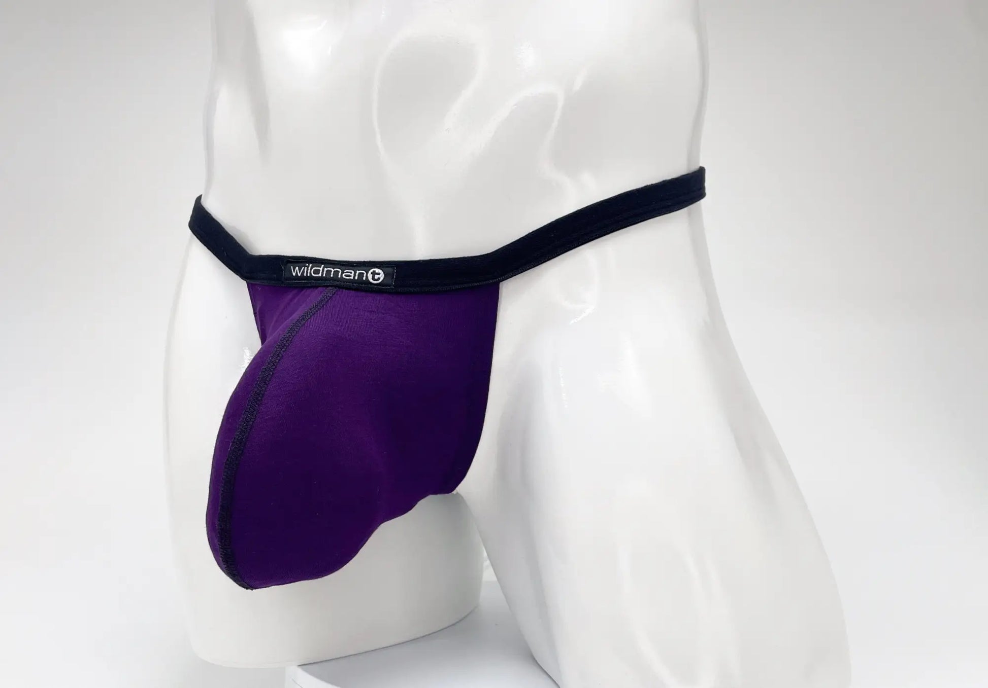 Purple wildman brand modal micro thong with black waistband and big boy pouch for comfortable support
