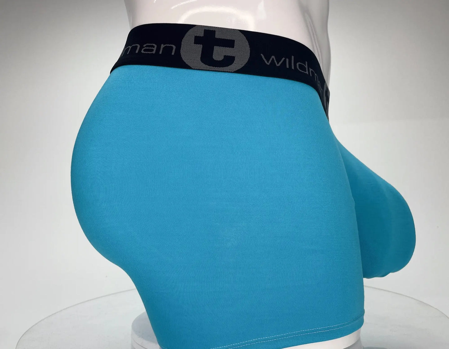 Bright blue wildmant modal monster cock 5 inseam boxer brief with black elastic waistband and logo
