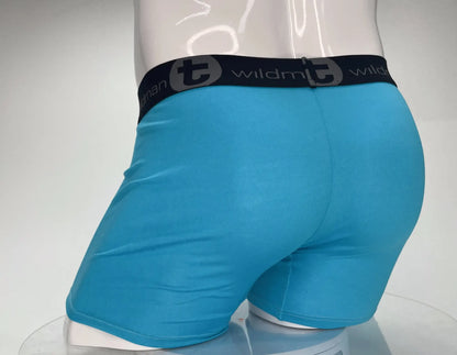 Bright turquoise wildman modal boxer briefs with black waistband featuring the wildman logo and 5 inch inseam