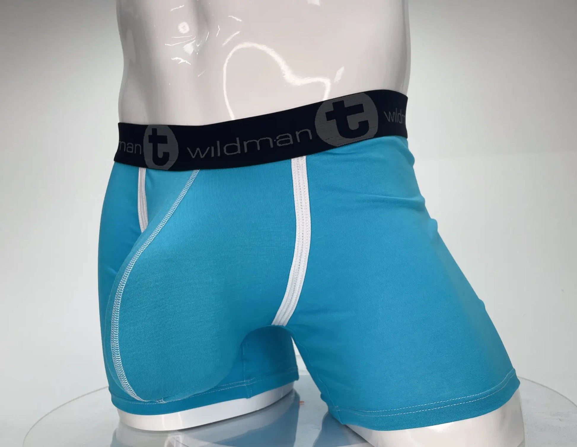 Bright blue wildmanT modal boxer briefs with black logo waistband and white side stitching 5 inch inseam