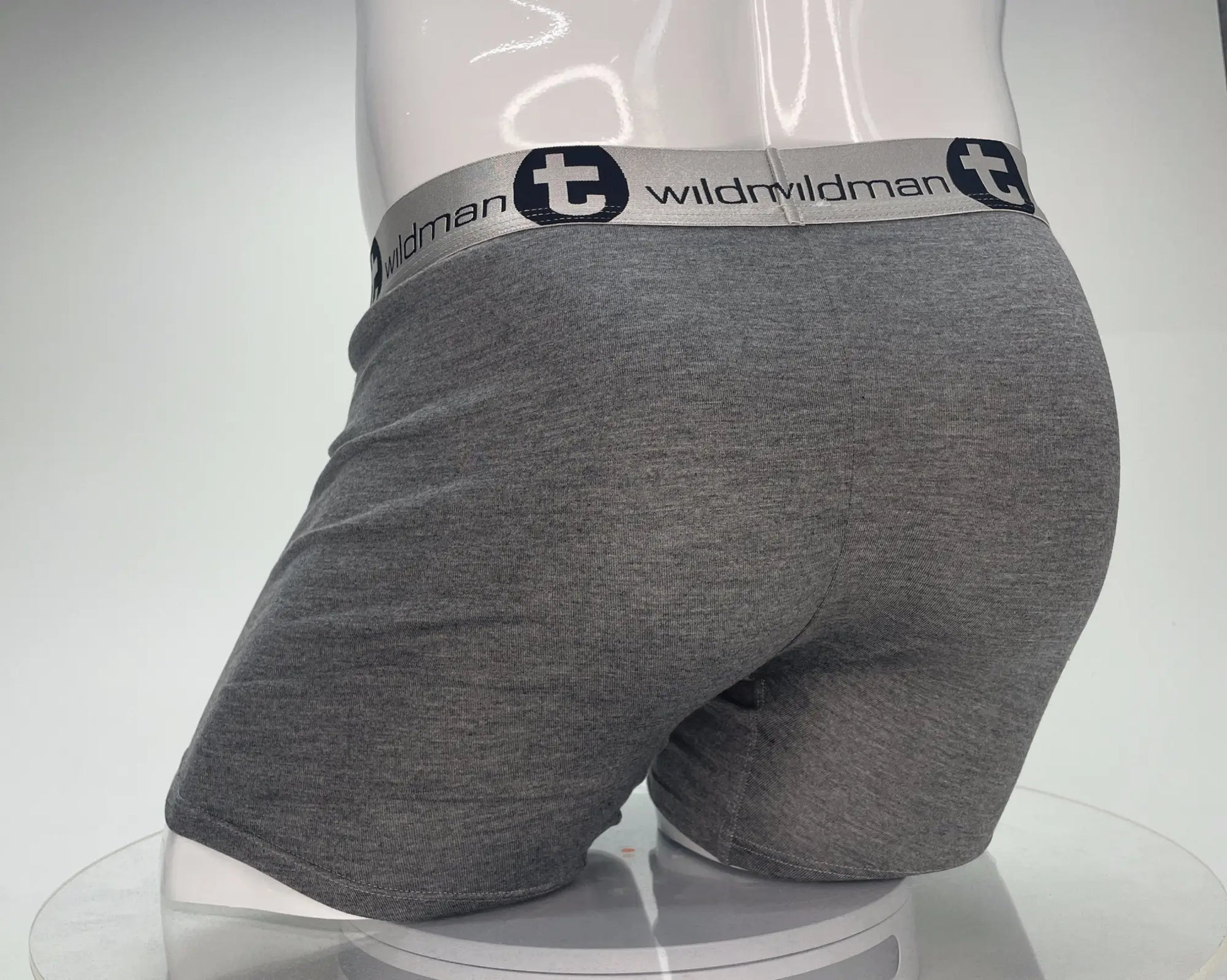 Gray heathered modal boxer briefs with white elastic waistband featuring wildman logo and black t emblem
