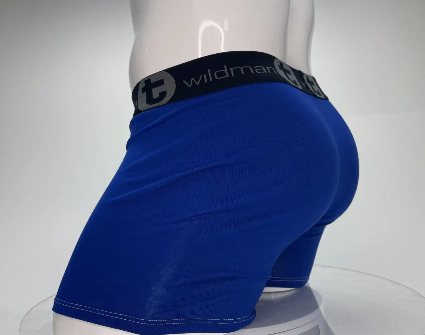Royal blue wildman brand boxer briefs with black elastic waistband featuring t logo and brand name in white lettering