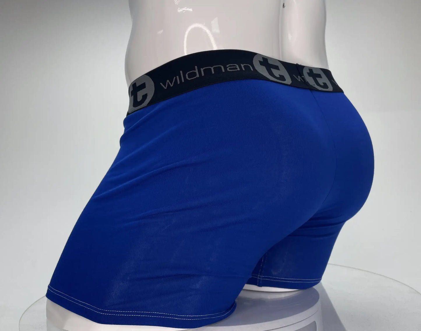 Blue wildman modal boxer briefs with black wildman logo waistband and stylized t emblem royal blue color