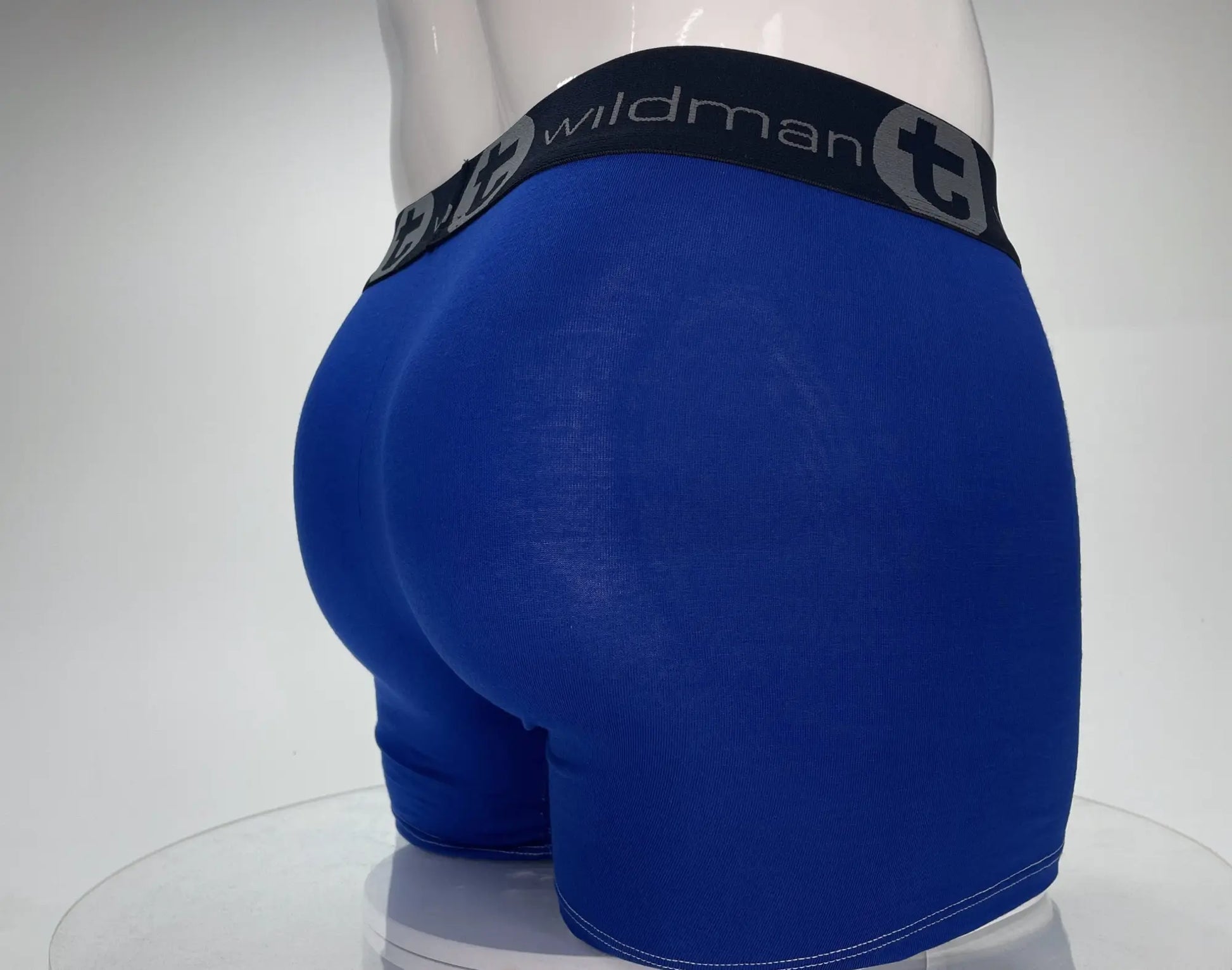 Wildman blue modal boxer briefs with 5 inch inseam black elastic waistband featuring wildman logo and stylized t emblem