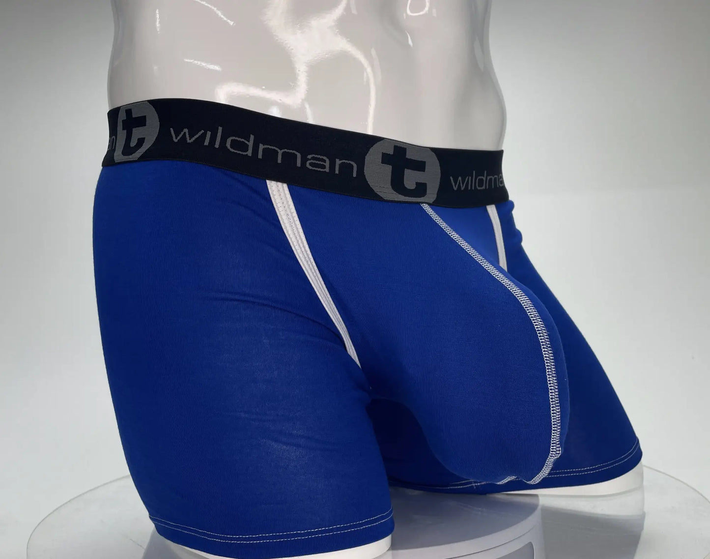 Blue wildman boxer briefs with white stitching and black waistband featuring brand logo in royal blue modal fabric