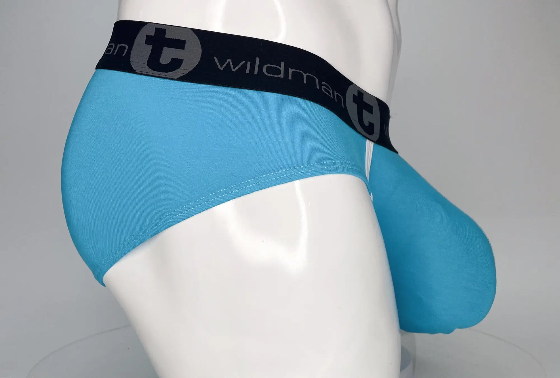 Light blue WildmanT modal monster cock brief for men with black elastic waistband and Wildman brand logo