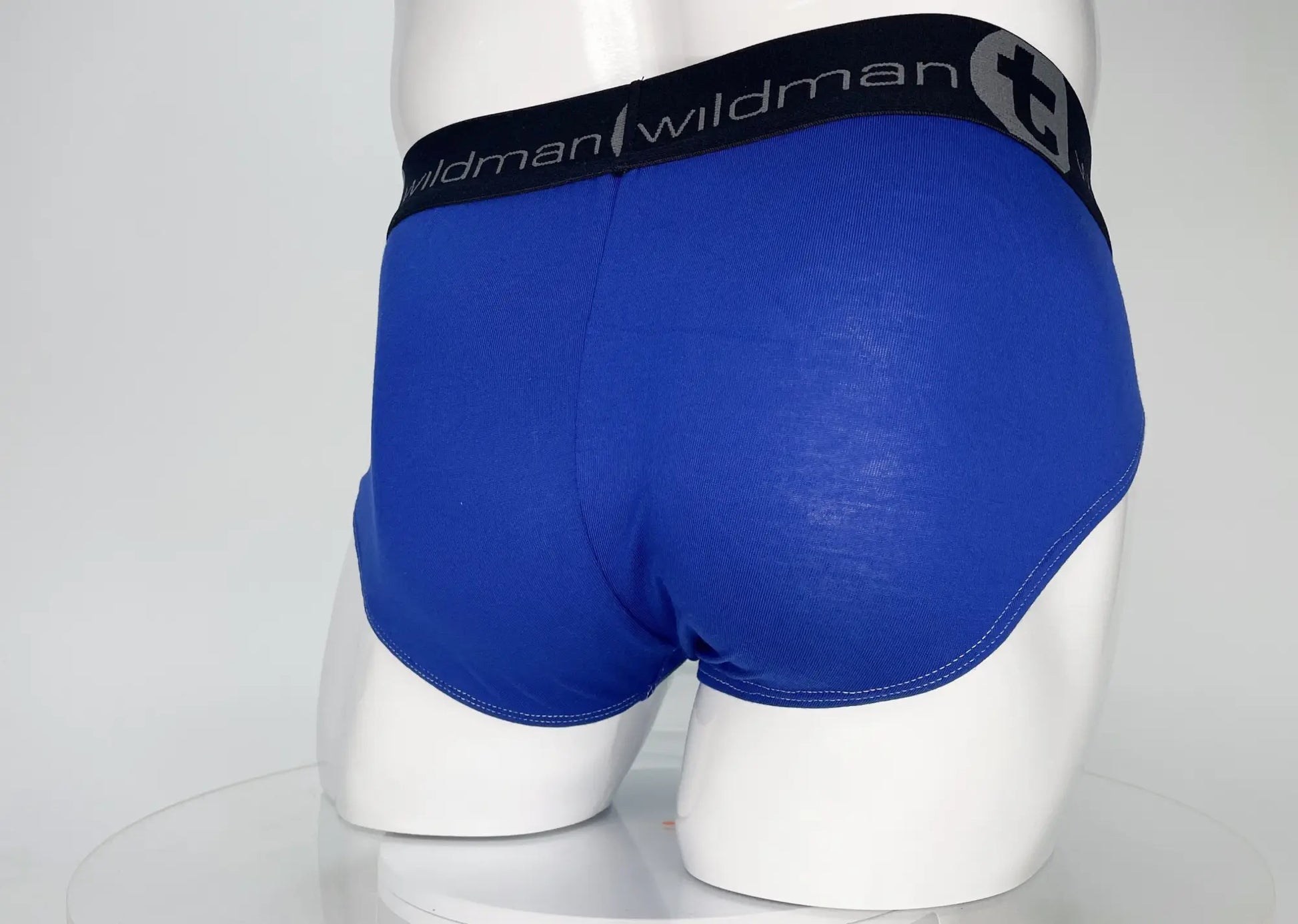 Wildmant modal monster cock brief in royal blue with black waistband featuring wildman logo and stylized t emblem