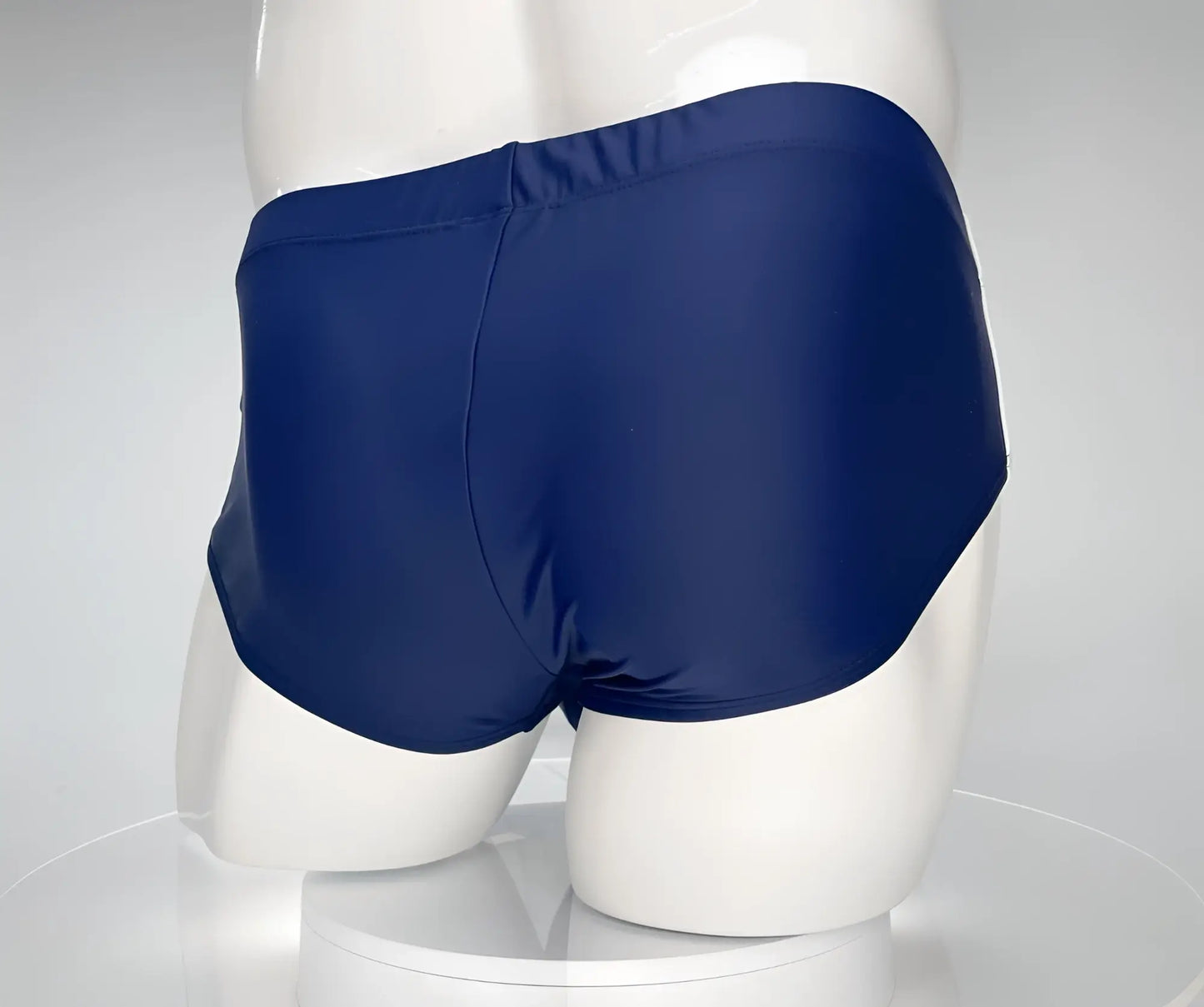 WildmanT monster cock swim brief navy in navy blue with smooth glossy fabric finish ideal for swimming and beachwear