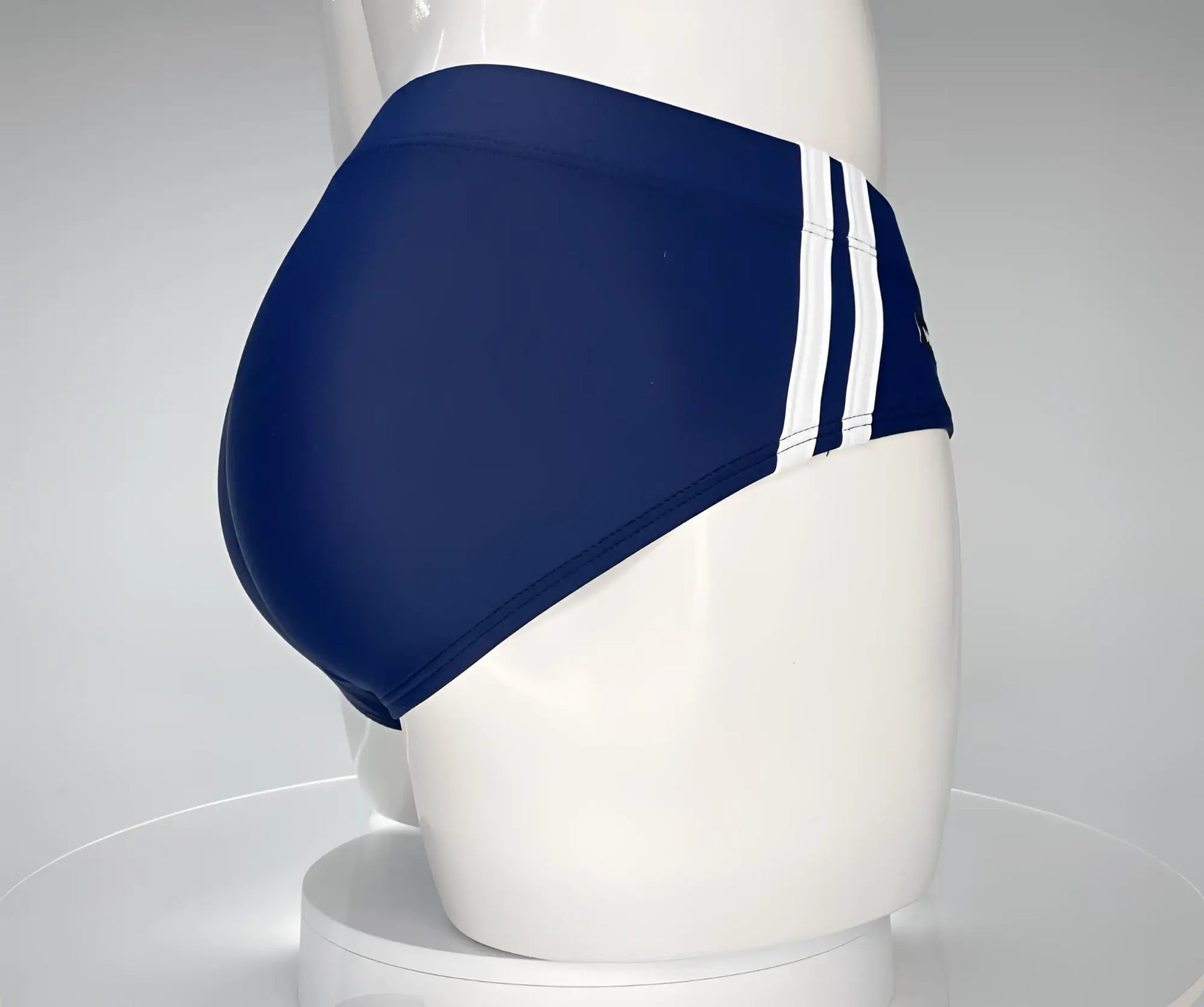 WildmanT Monster Cock swim brief navy blue with three white vertical stripes on the side for swimwear use