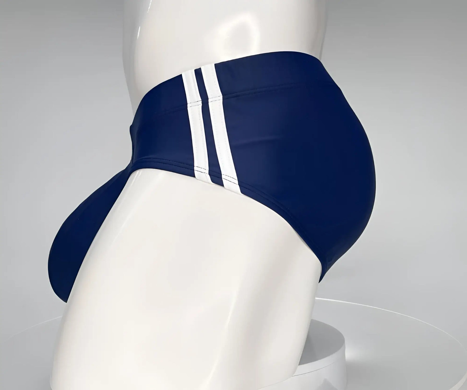 WildmanT Monster Cock swim brief navy in navy blue with three white vertical stripes on the side for swimming