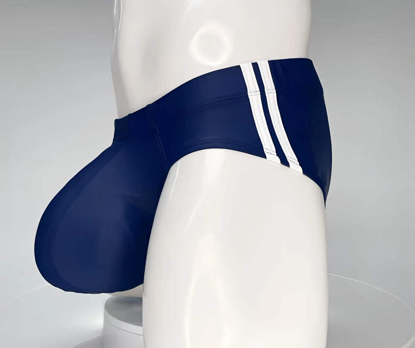 WildmanT monster cock swim brief navy blue swim trunks with three white stripes on the side for swimming
