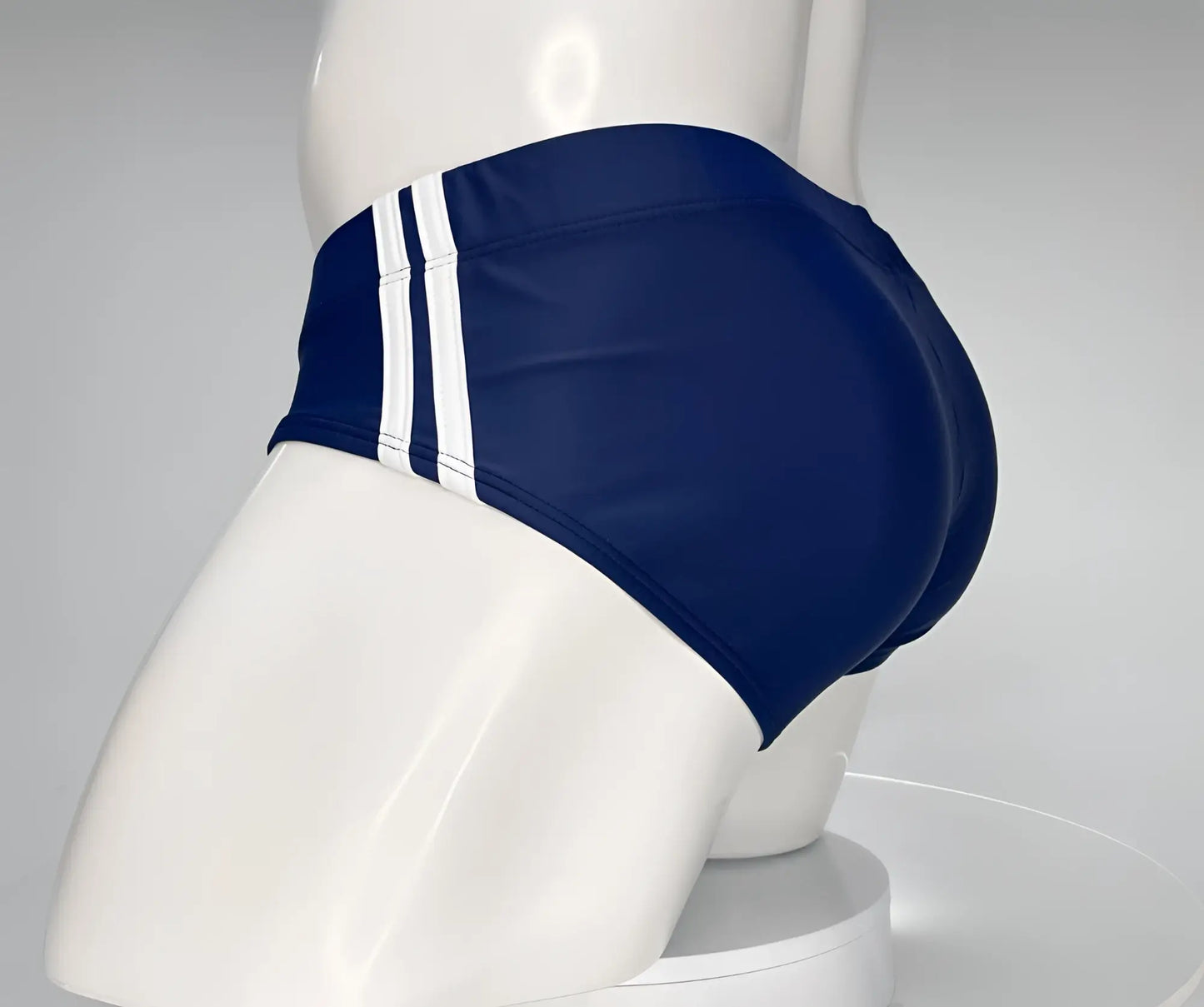 WildmanT monster cock swim brief navy blue with two white vertical stripes designed for swimming and beachwear