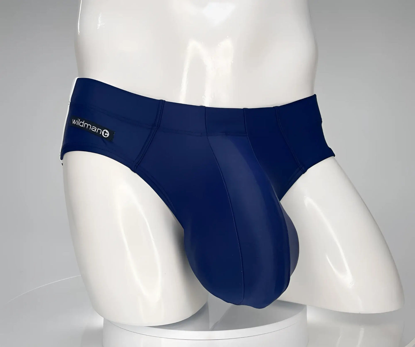 Navy blue wildman brand men’s briefs with smooth form-fitting design from wildmant monster cock swim brief navy collection