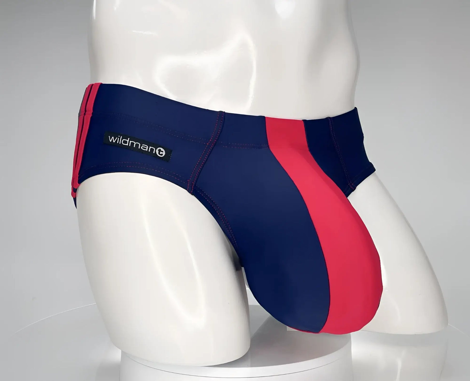 Wildman navy red striped swim brief featuring a monster cock design in a comfortable quick-dry fabric