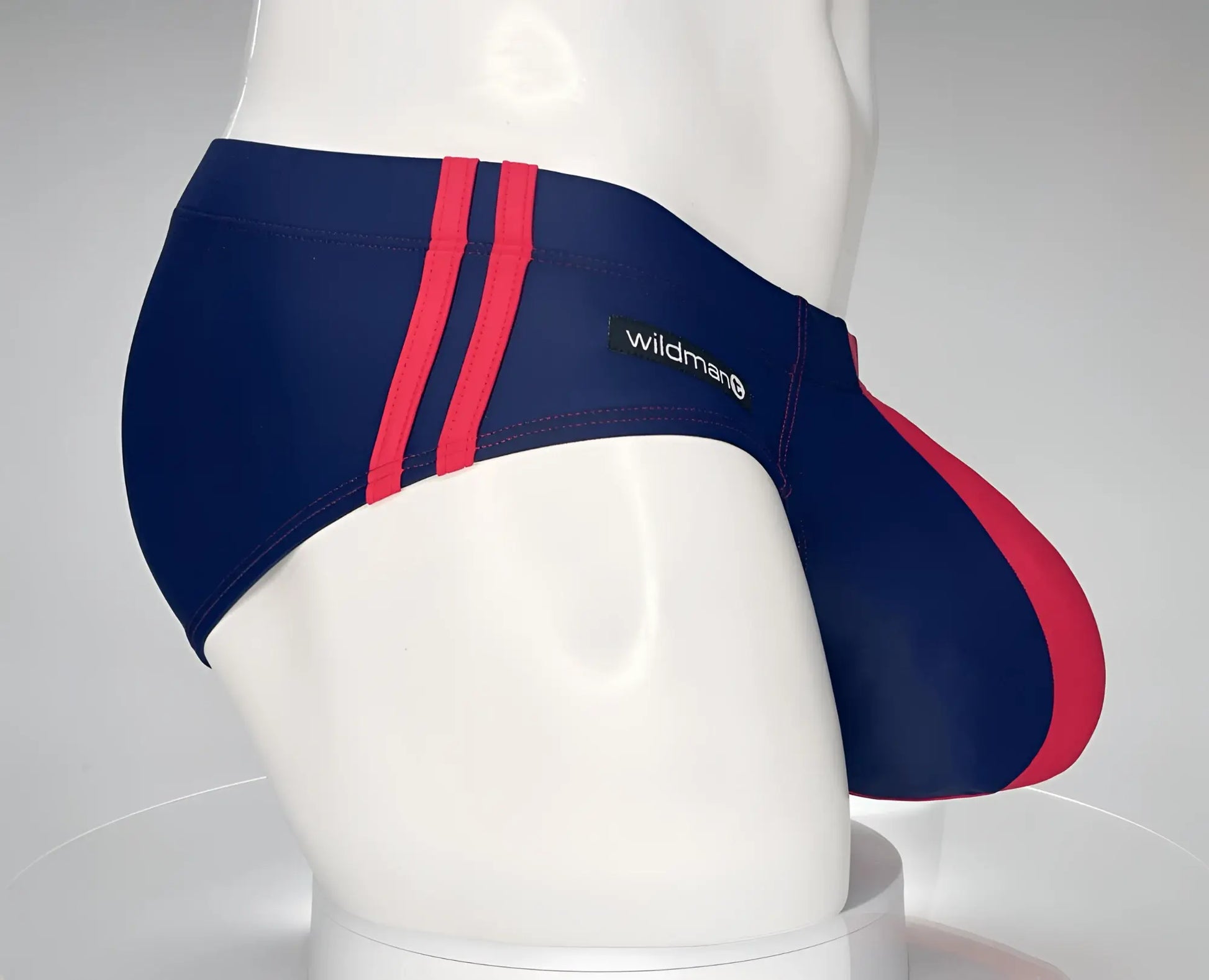 WildmanT monster cock swim brief navy red striped with wildman brand label designed for swimming and beachwear
