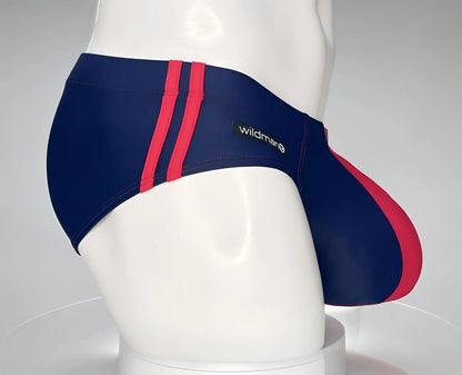 WildmanT monster cock swim brief navy red striped with wildman brand label designed for swimming and beachwear