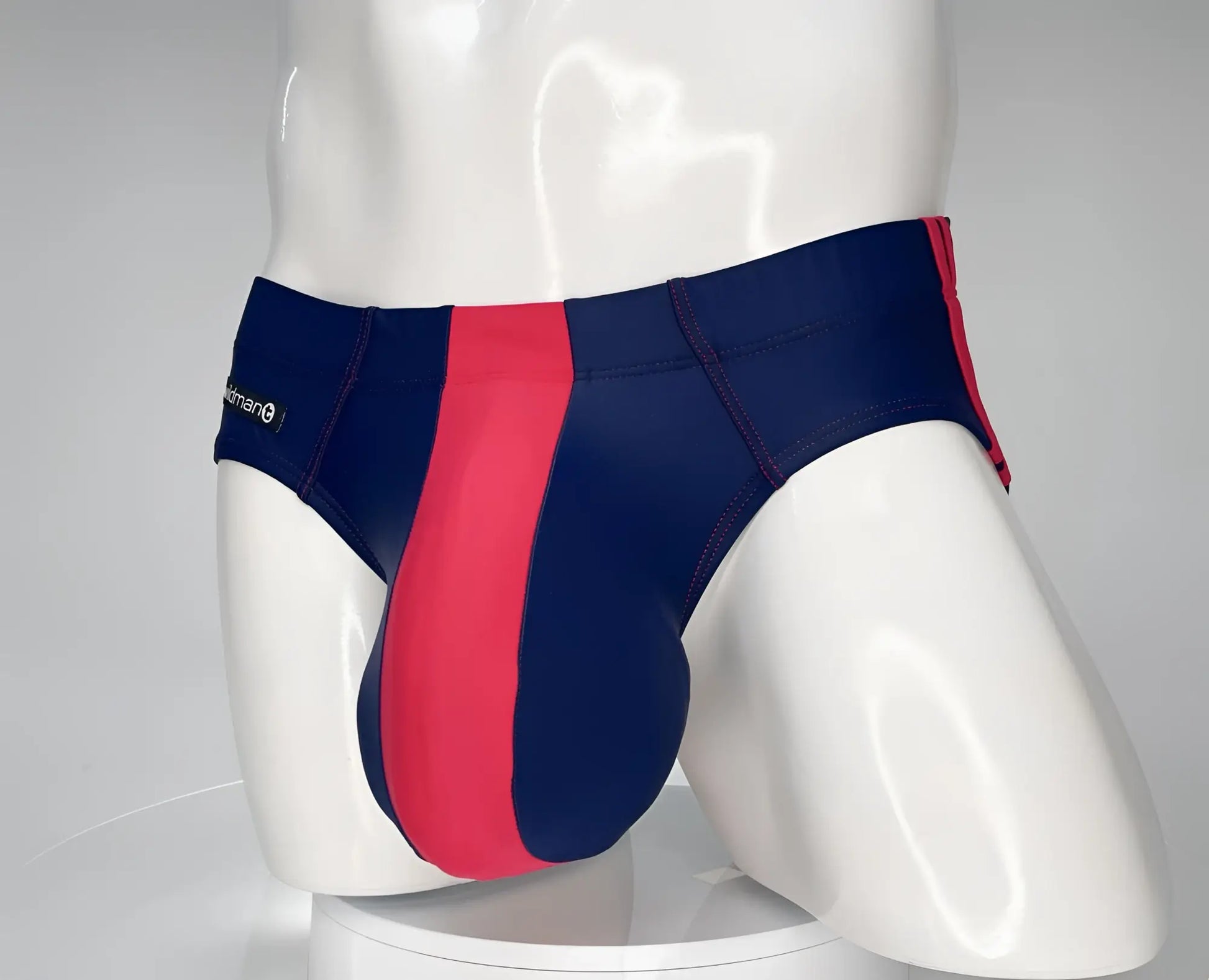 WildmanT Monster Cock swim brief in navy and red striped design with a sleek, form-fitting style for men