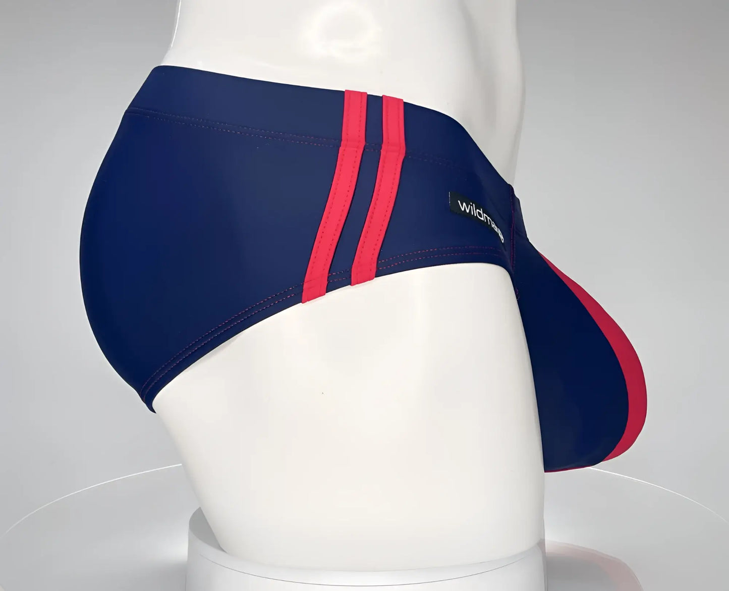 Wildmant monster cock swim brief navy red with bold red stripes and sleek form fitting design for swimwear use