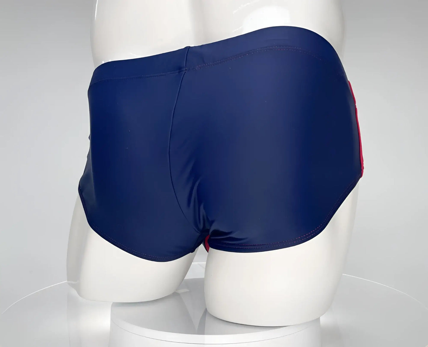 Wildmant monster cock swim brief navy with red side stripe showing front view for swimming and beachwear