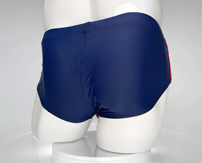 Wildmant monster cock swim brief navy with red side stripe showing front view for swimming and beachwear