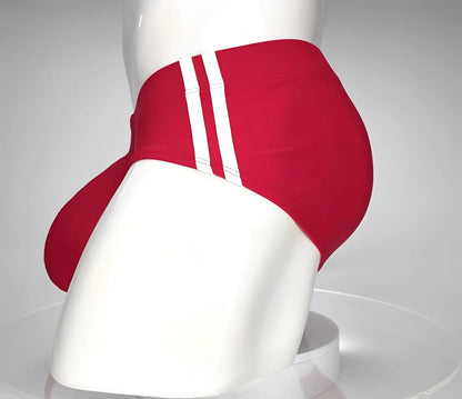 WildmanT monster cock swim brief in red with three white stripes down the side for athletic swim use