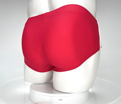 WildmanT monster cock swim brief red bright red swim trunks with smooth form-fitting fabric and white side stripes