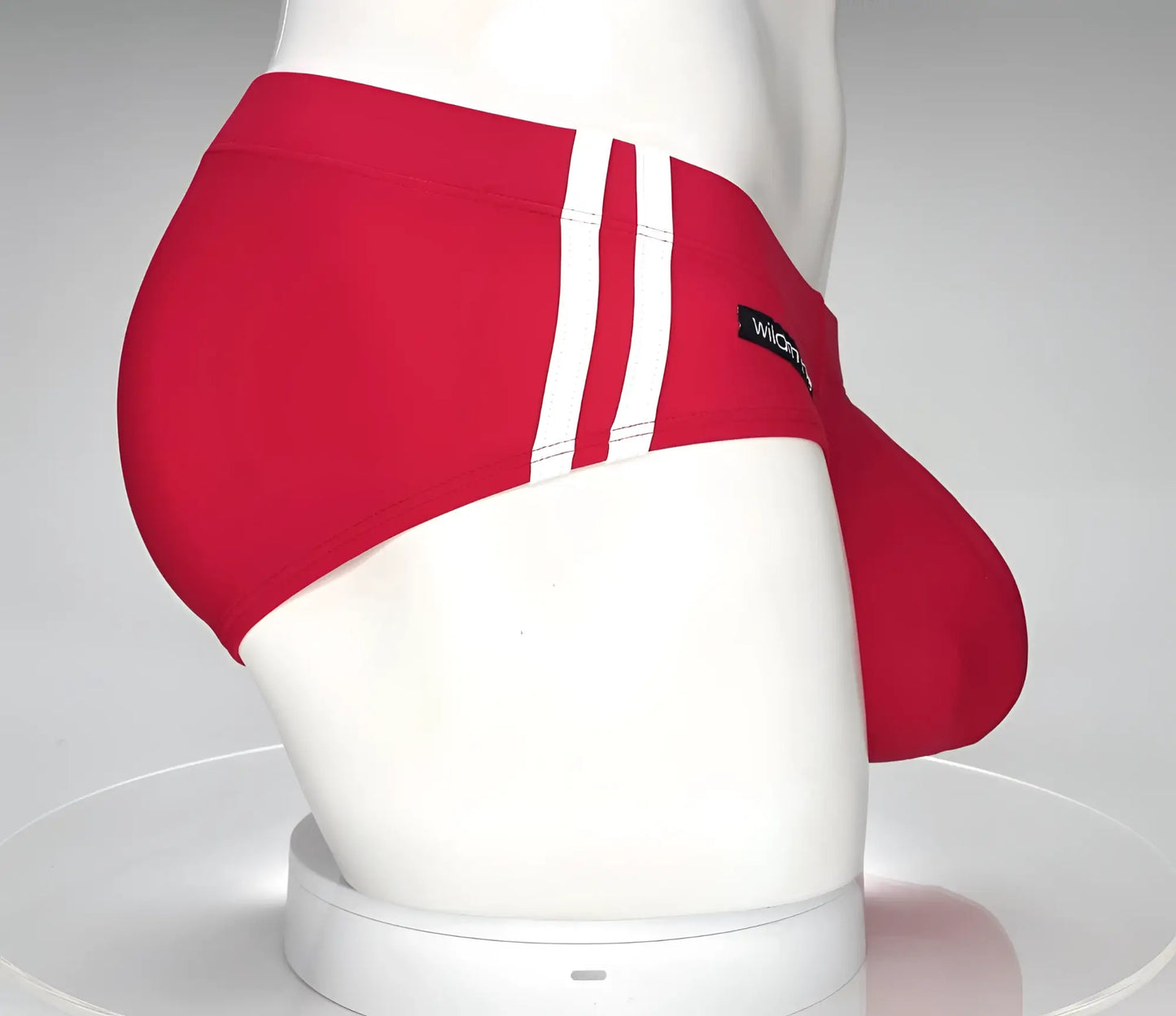 Wildmant monster cock swim brief red swim trunks with three white stripes and black wicked brand label