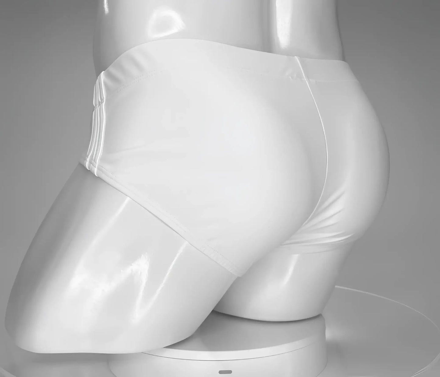 White glossy latex swim briefs wildmant monster cock with sleek form-fitting design for swimwear use