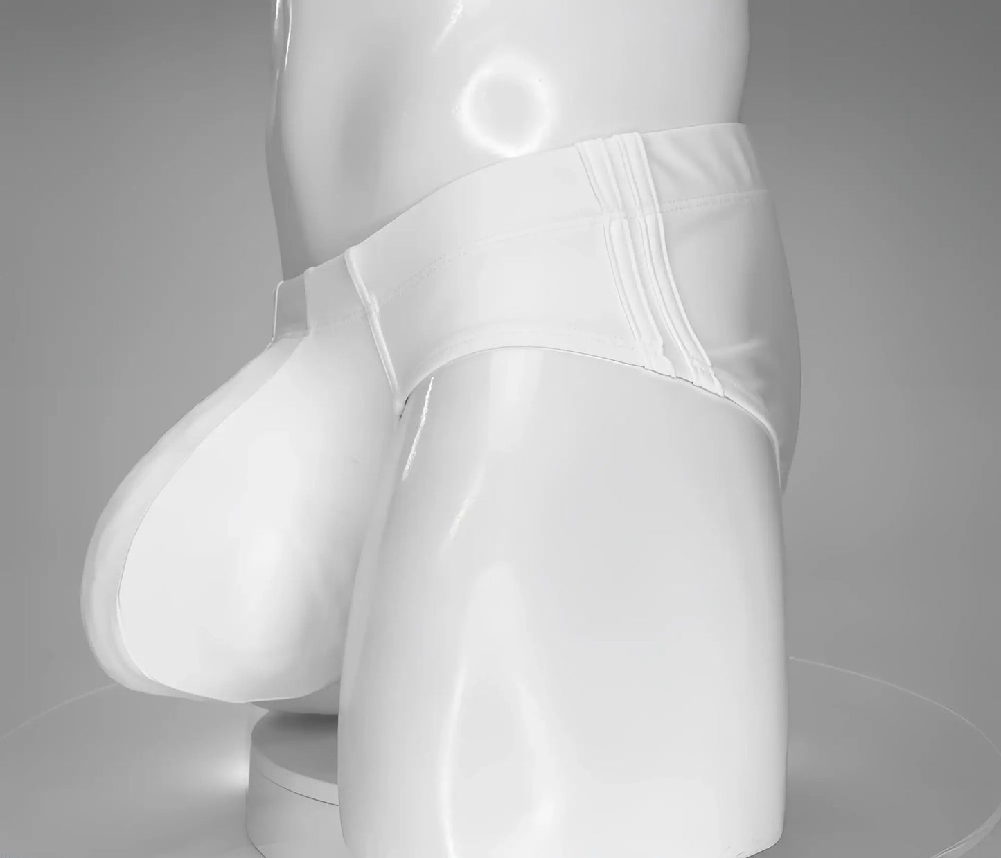 WildmanT monster cock swim brief white glossy latex briefs with smooth form-fitting design and visible seams