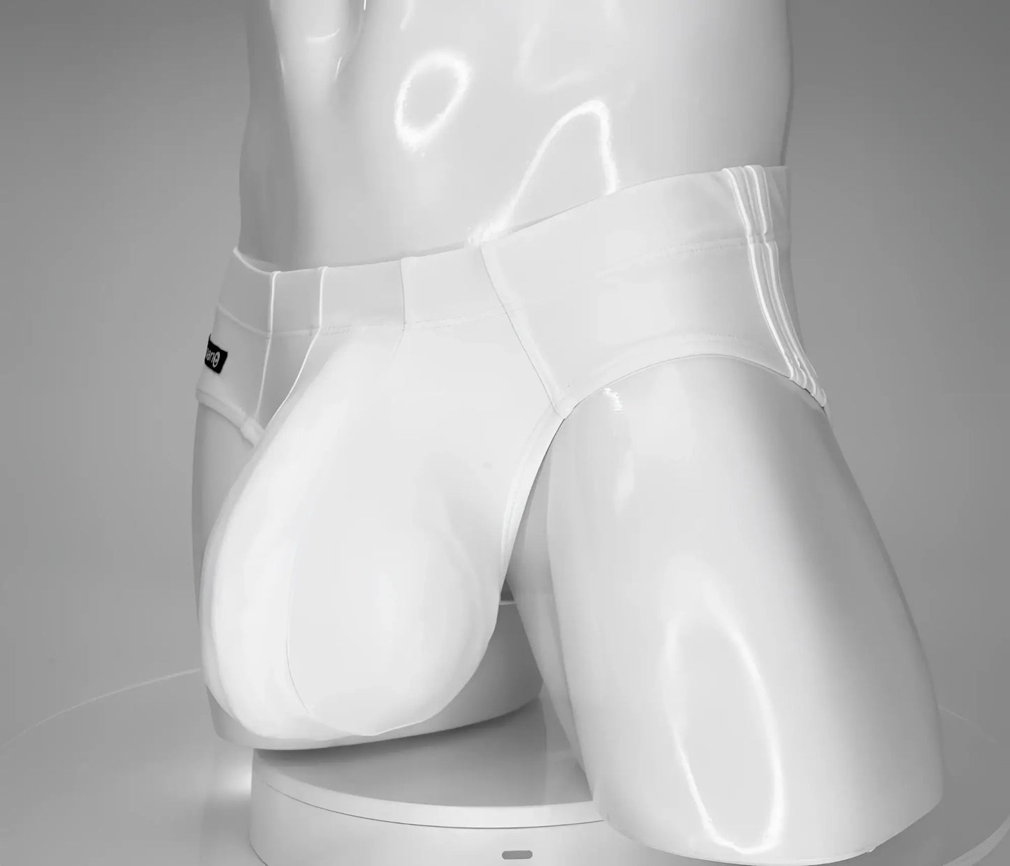 Wildmant monster cock swim brief white glossy briefs with sleek form-fitting design and subtle stitching details