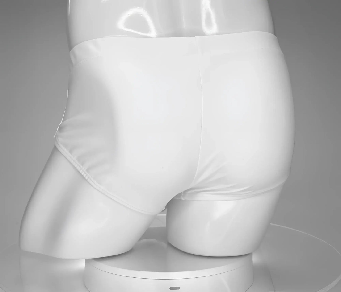 Wildmant monster cock swim brief white displayed on mannequin showing front white swim briefs with bold design
