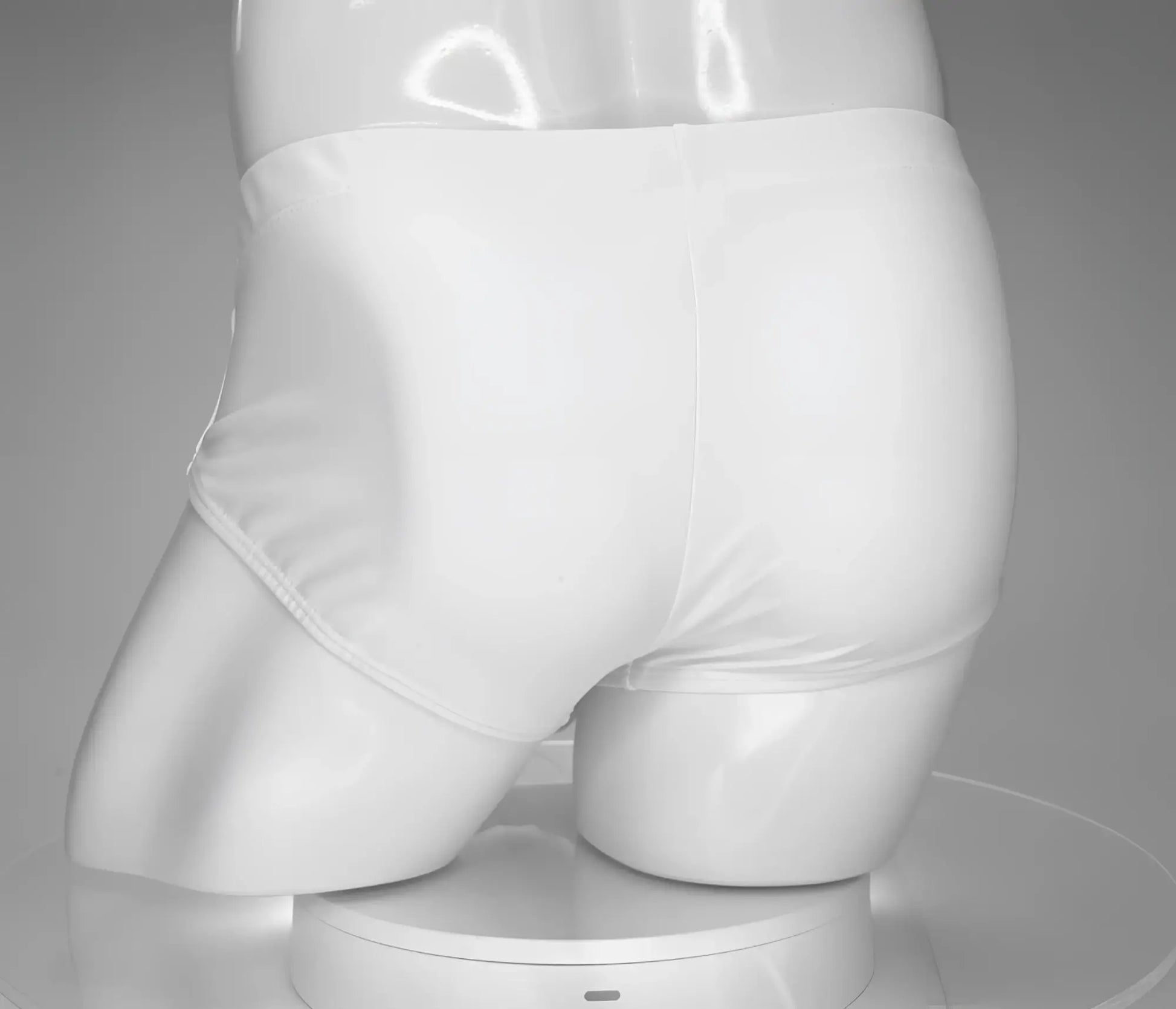 Wildmant monster cock swim brief white displayed on mannequin showing front white swim briefs with bold design