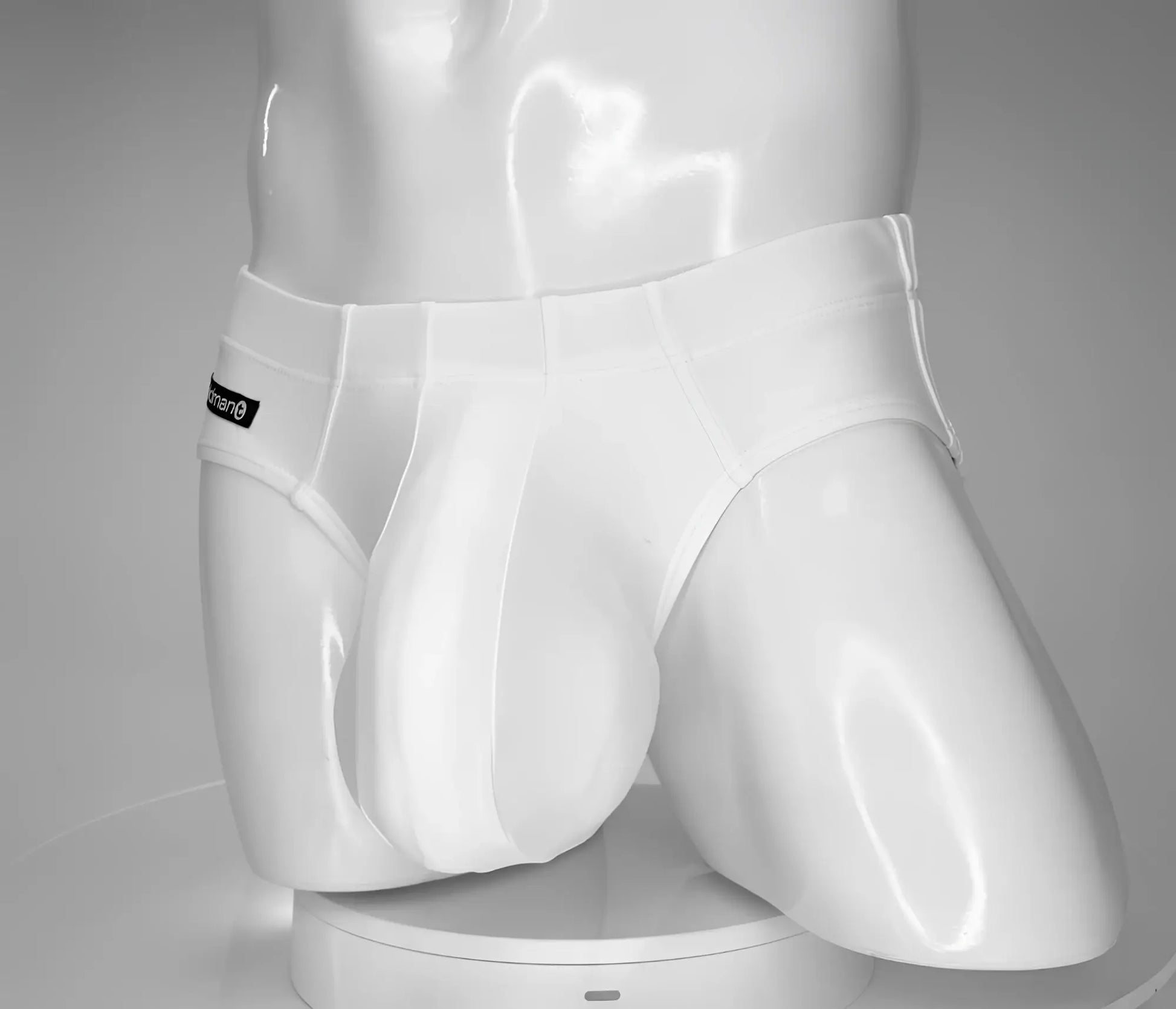 Wildmant monster cock swim brief white in sleek form-fitting white men’s briefs with subtle brand tag on waistband