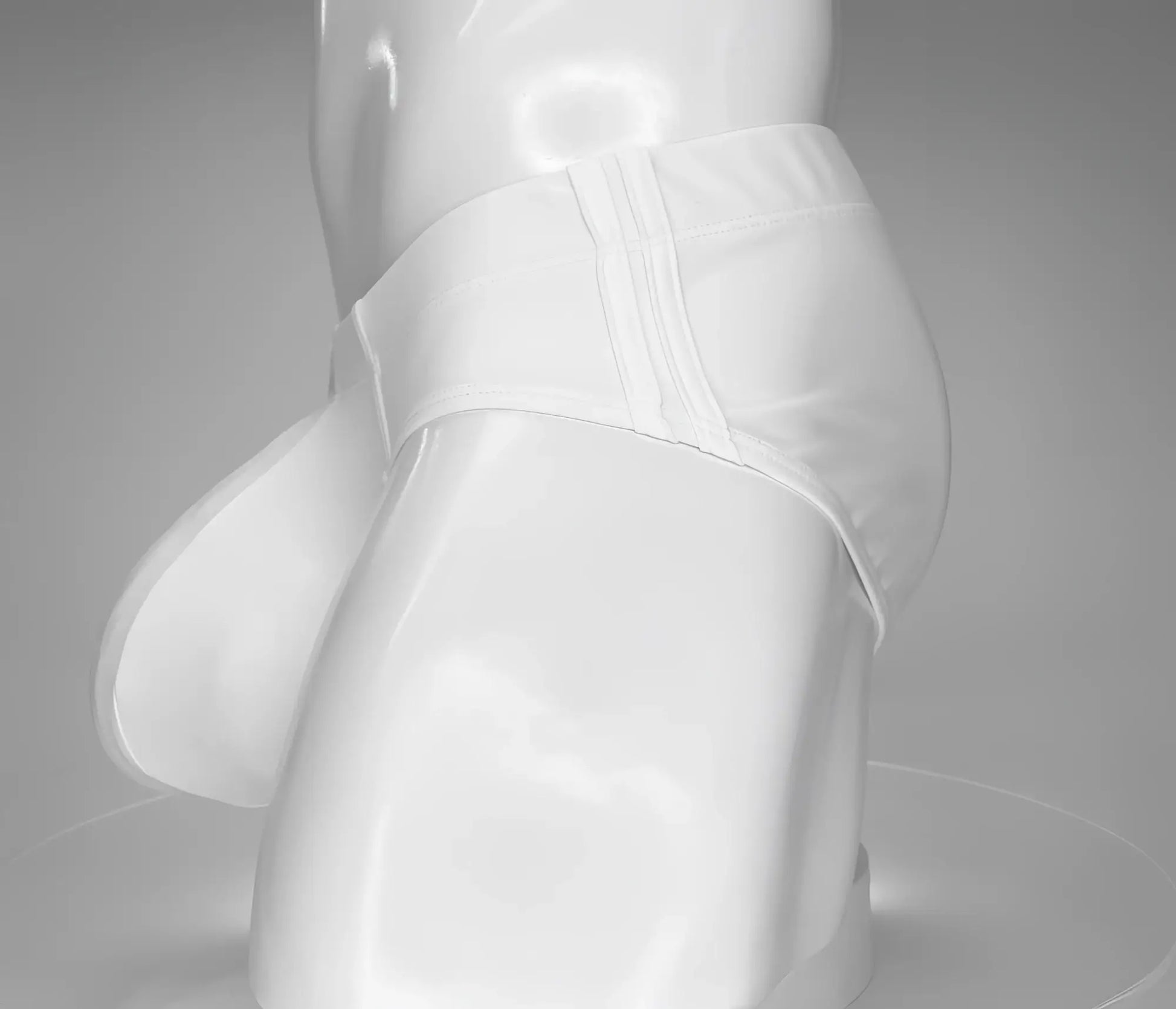 Wildmant monster cock swim brief white satin-like fabric with glossy finish and subtle vertical seam detailing