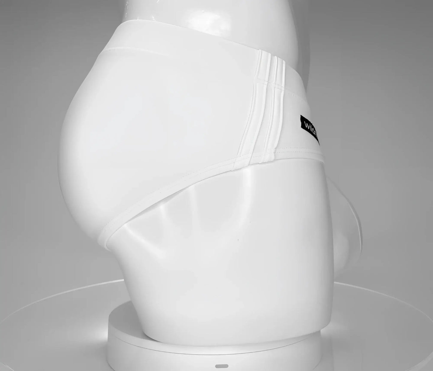 Wildmant monster cock swim brief white with sleek form-fitting design and subtle vertical stitching along the side