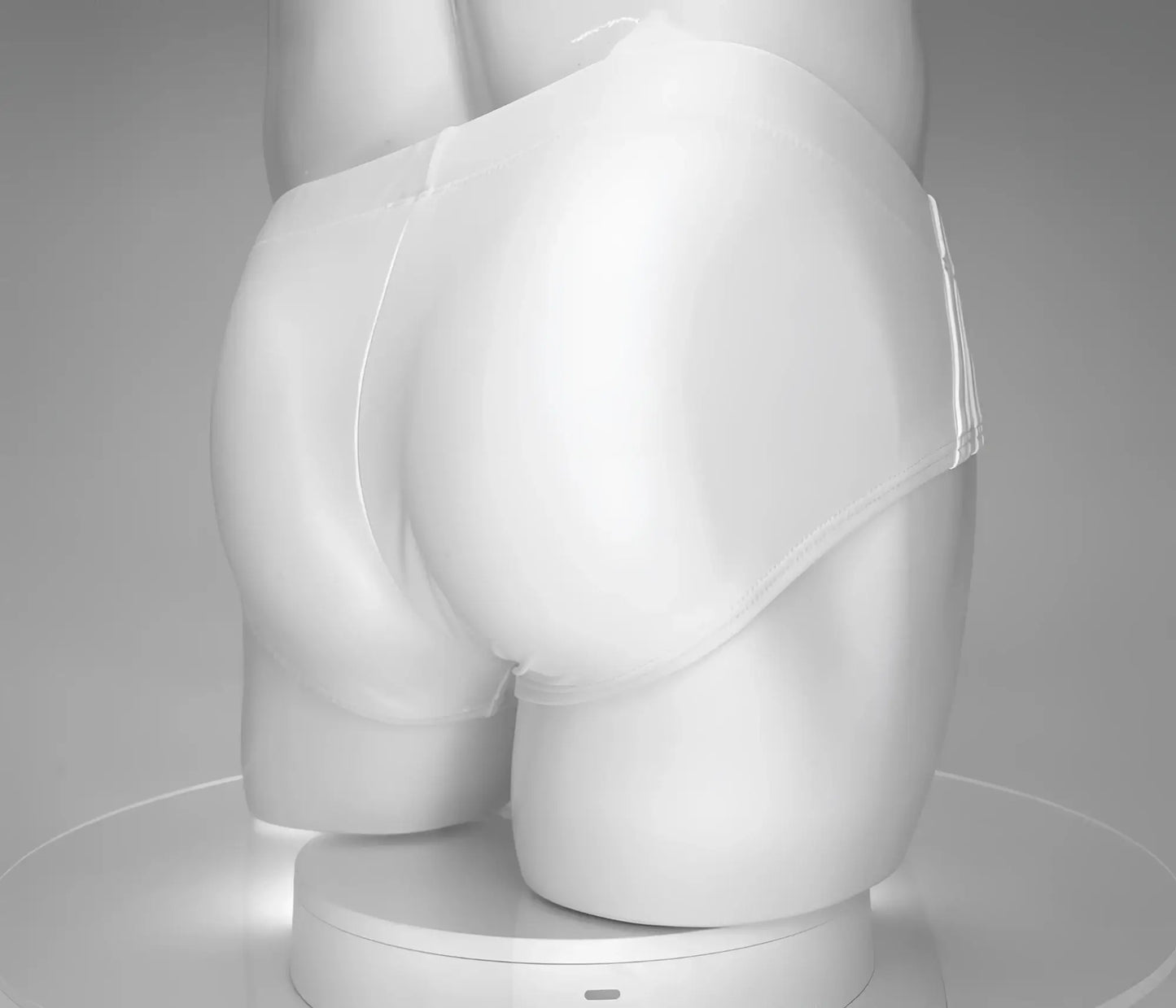 Wildmant monster cock swim brief white smooth textured white swim briefs displayed on a mannequin front side