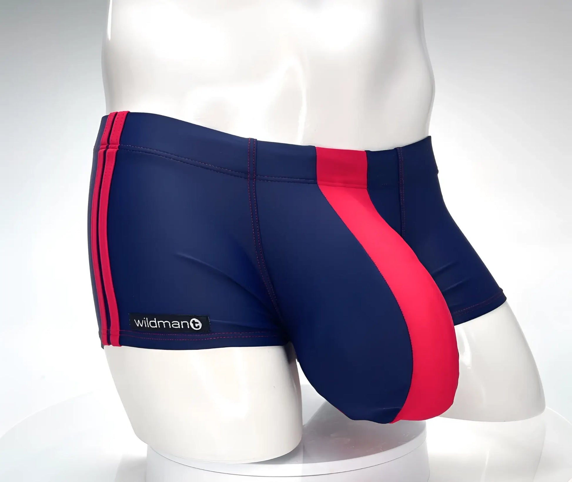 WildmanT monster cock swim square cut swim trunks in navy and red stripes with wildman brand label visible on the side