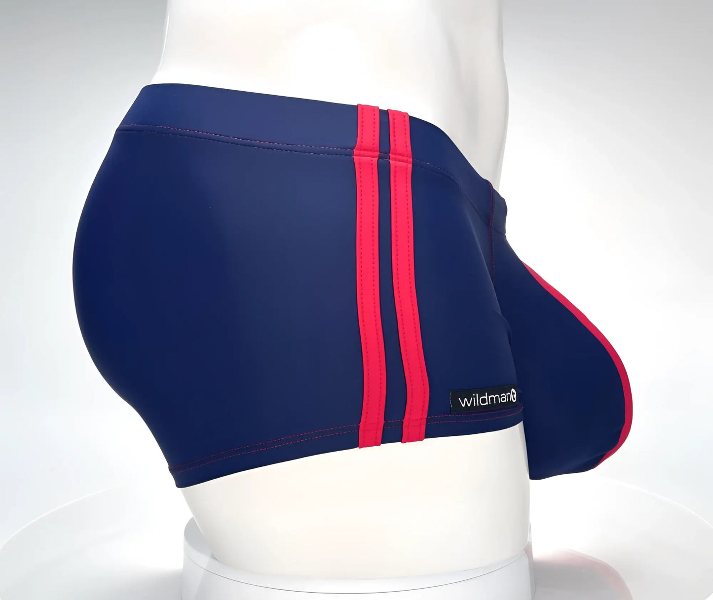 Navy blue wildman swim square cut trunks with bold red stripes and wildman brand label for swimming use