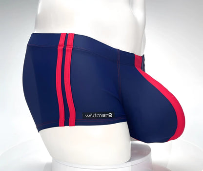 Navy blue swim square cut trunks with bold red stripes and wildman brand label for swimming and beachwear