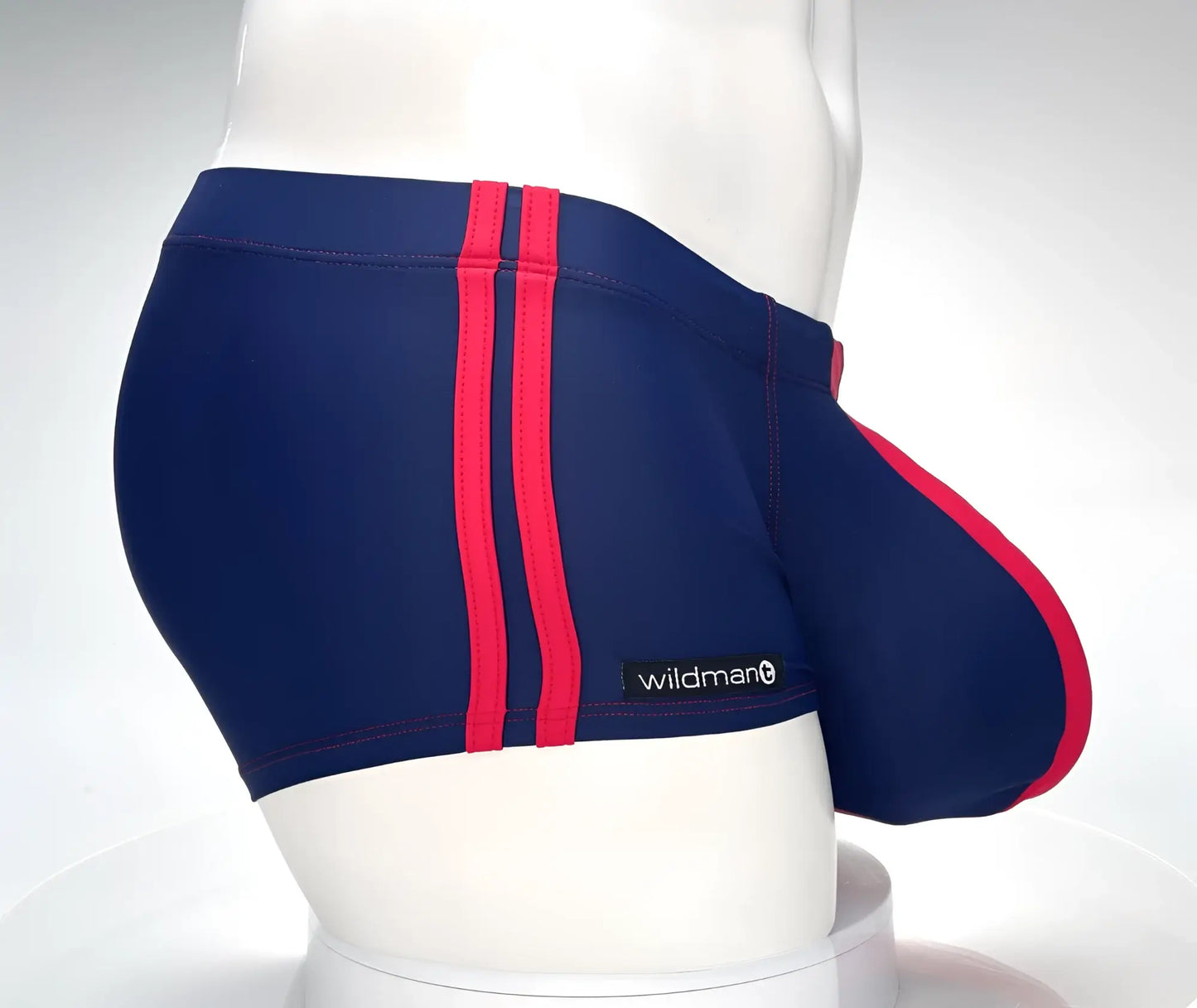 WildmanT navy blue swim square cut trunks with bold red stripes and wildman brand label for swimming