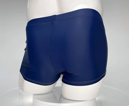 WildmanT Monster Cock navy swim square cut trunks with glossy finish and contrasting white stitching along hem