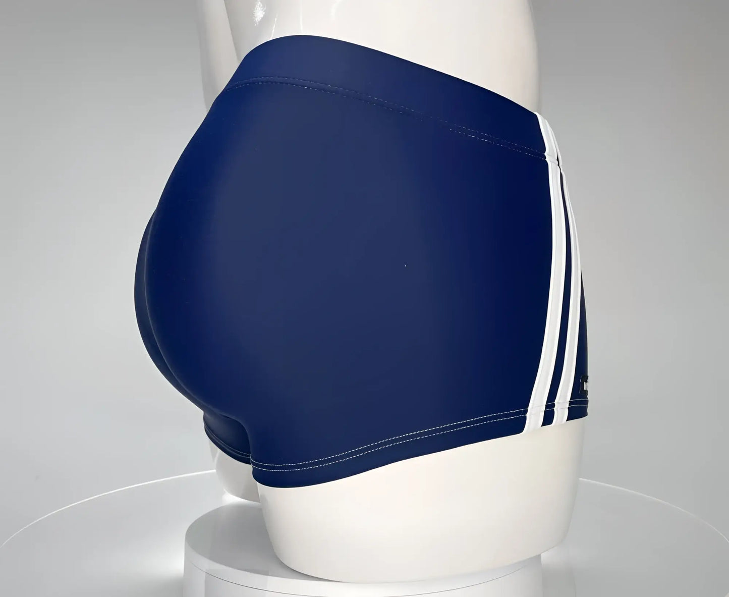 WildmanT Monster Cock swim square cut navy blue swim trunks with three white stripes on the side for swimming